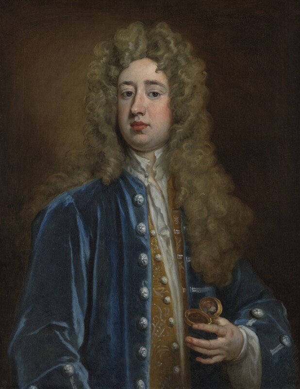 Oil portrait painting of Charles Mohun, 4th Baron Mohun. He has a long grey wig on, is wearing a white undershirt with a gold shirt on top. He is wearing a blue jacket with silver buttons. In his left hand he is holding a gold snuff box that has a photo in it.